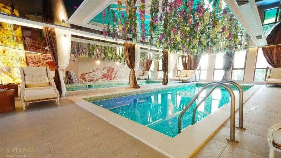 Elegant indoor swimming pool in luxury Harmony Suites, Monte Carlo, Sunny Beach.