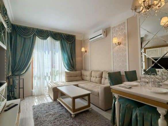 Modern living room with elegant decor and large windows in Sunny Beach.