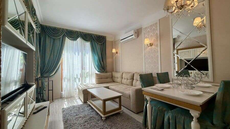 Luxury 1 Bed Apartment in Harmony Suites Modern living room with elegant decor and large windows in Sunny Beach.