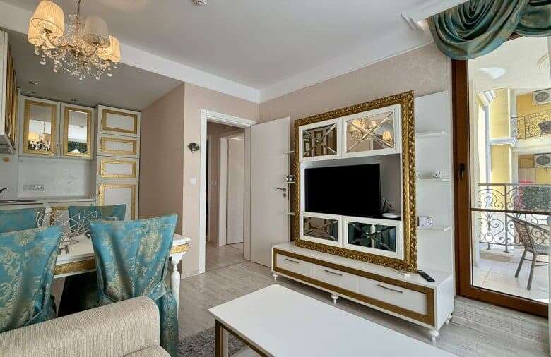 Bright living room with modern decor and balcony view.