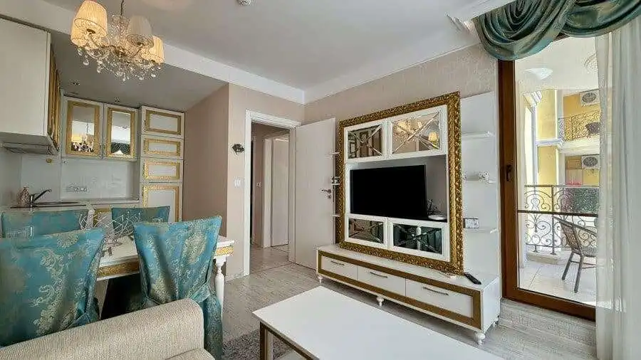 Bright living room with modern decor and balcony view.
