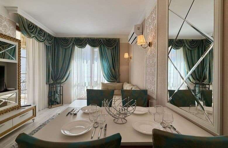 Bright living room with large windows and elegant curtains in Sunny Beach.