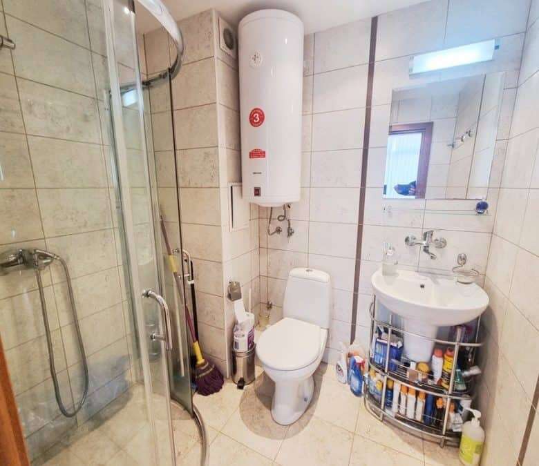 Bright bathroom with modern fixtures and shower enclosure in Dawn Park, Sunny Beach.