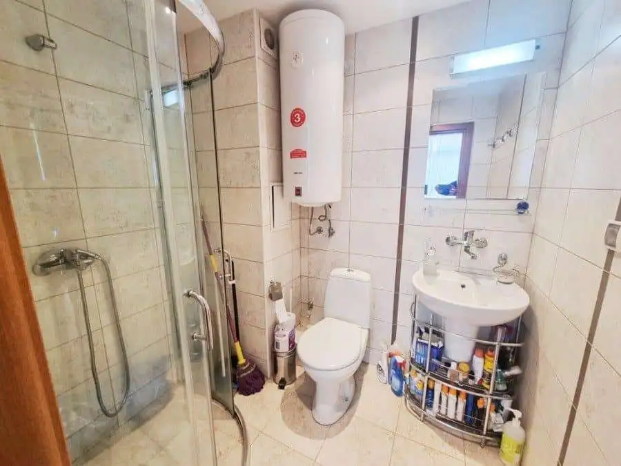 Bright bathroom with modern fixtures and shower enclosure in Dawn Park, Sunny Beach.