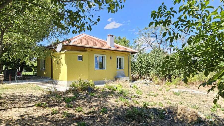 Bright yellow renovated house with spacious land in Dyulevo, near Burgas, Bulgaria.