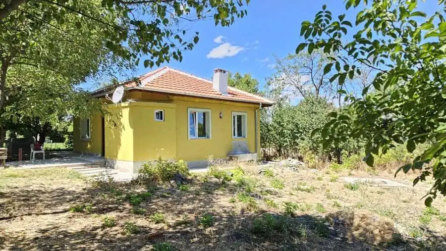 Bright yellow renovated house with spacious land in Dyulevo, near Burgas, Bulgaria.