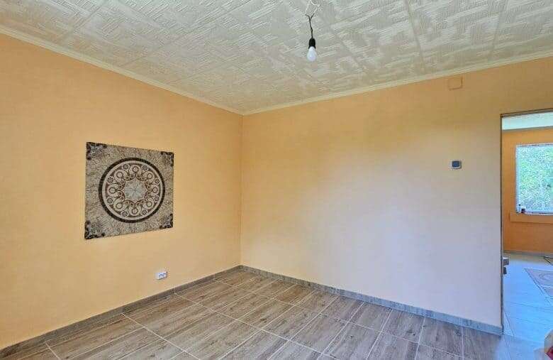 Renovated house interior with spacious living area and large window in Dyulevo, near Burgas, Bulgari.
