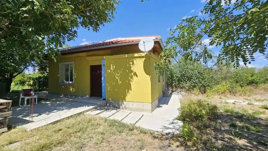 Bright yellow renovated house on spacious land near Burgas, Bulgaria.