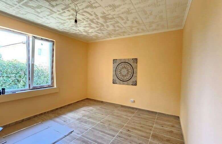 Renovated house interior with spacious room and large window in Dyulevo, near Burgas.