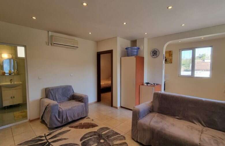 Spacious living room in a 3-bedroom house near Ropotamo Valley, featuring a pool and outdoor BBQ spa.