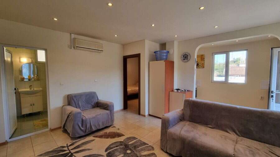 Spacious living room in a 3-bedroom house near Ropotamo Valley, featuring a pool and outdoor BBQ spa.