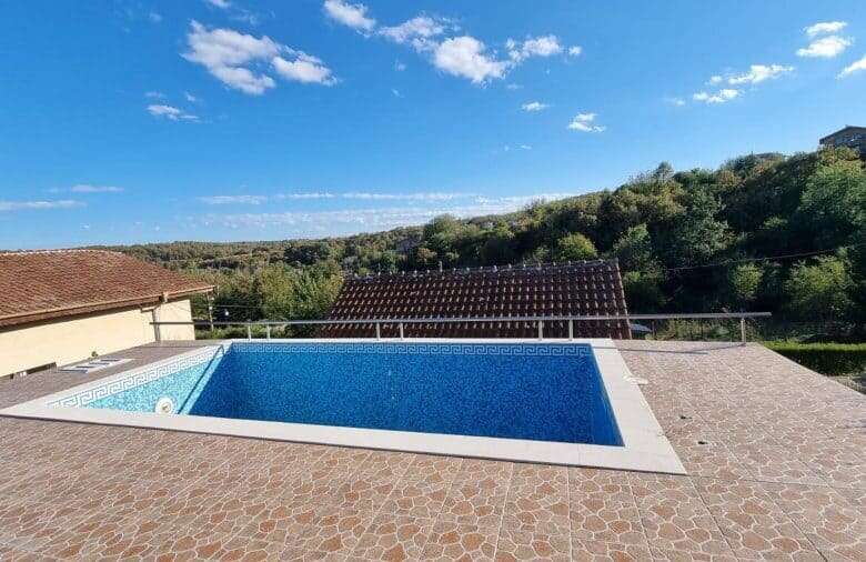 Bright view of a private swimming pool with surrounding terrace in Ropotamo Valley, near Primorsko.