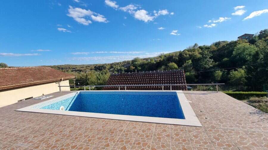 Bright view of a private swimming pool with surrounding terrace in Ropotamo Valley, near Primorsko.