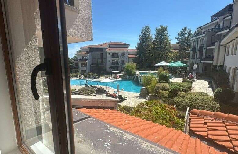 Bright furnished apartment overlooking pool and garden.