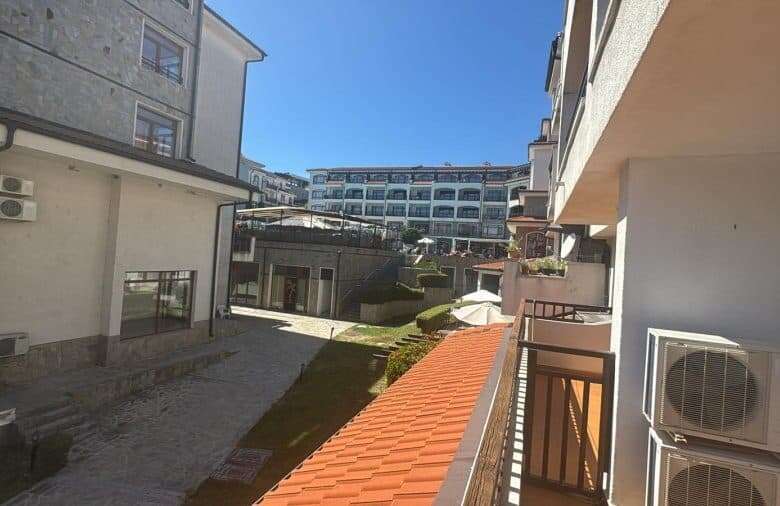 Bright view of a contemporary residential complex near the sea.