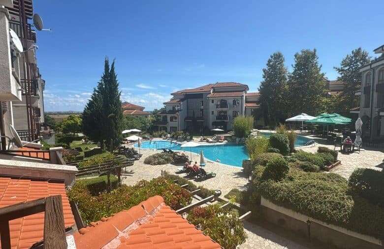 Vineyards SPA Resort pool with landscaped gardens, outdoor seating, and relaxing environment near th.