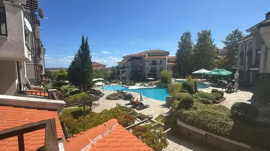 Vineyards SPA Resort pool with landscaped gardens, outdoor seating, and relaxing environment near th.