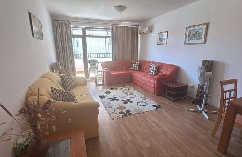 Bright living room with comfortable sofas and large window.