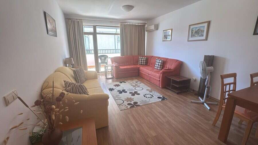 Spacious furnished apartment in Vineyards SPA Resort Bright living room with comfortable sofas and large window.