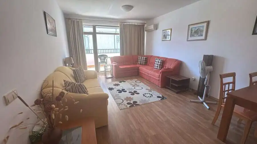 Bright living room with comfortable sofas and large window.