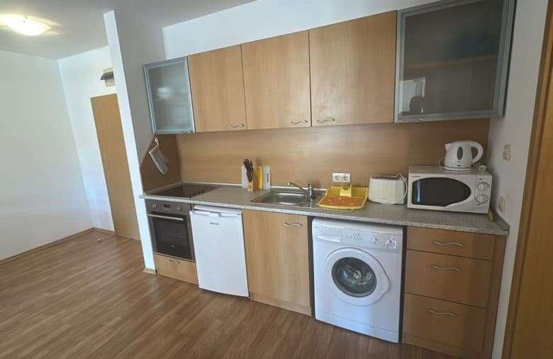 Modern kitchen with appliances in Vineyards SPA Resort apartment.