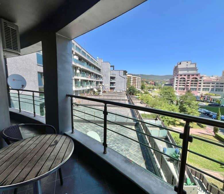 Balcony view of Sunny Beach with modern buildings and green spaces, 100m from the sea.