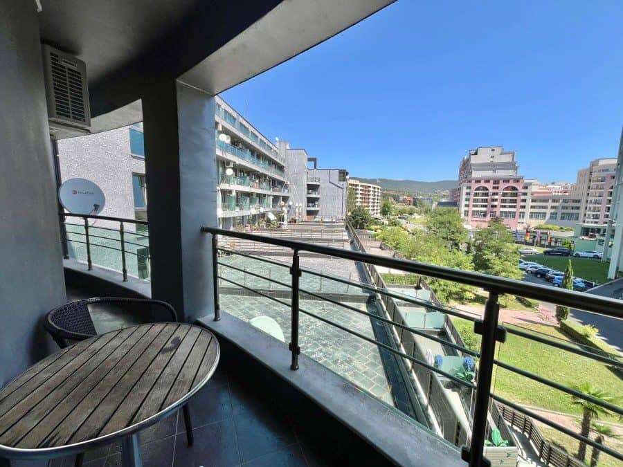 Balcony view of Sunny Beach with modern buildings and green spaces, 100m from the sea.