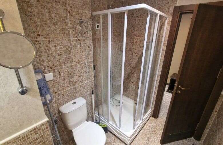 Bathroom with shower cabin in a studio apartment at Barcelo Royal Beach, Sunny Beach.