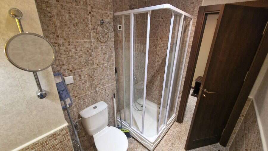 Bathroom with shower cabin in a studio apartment at Barcelo Royal Beach, Sunny Beach.