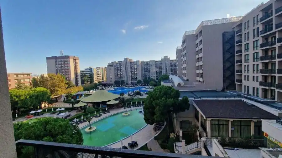 View of pool and surrounding buildings from a studio apartment in Sunny Beach, Bulgaria.