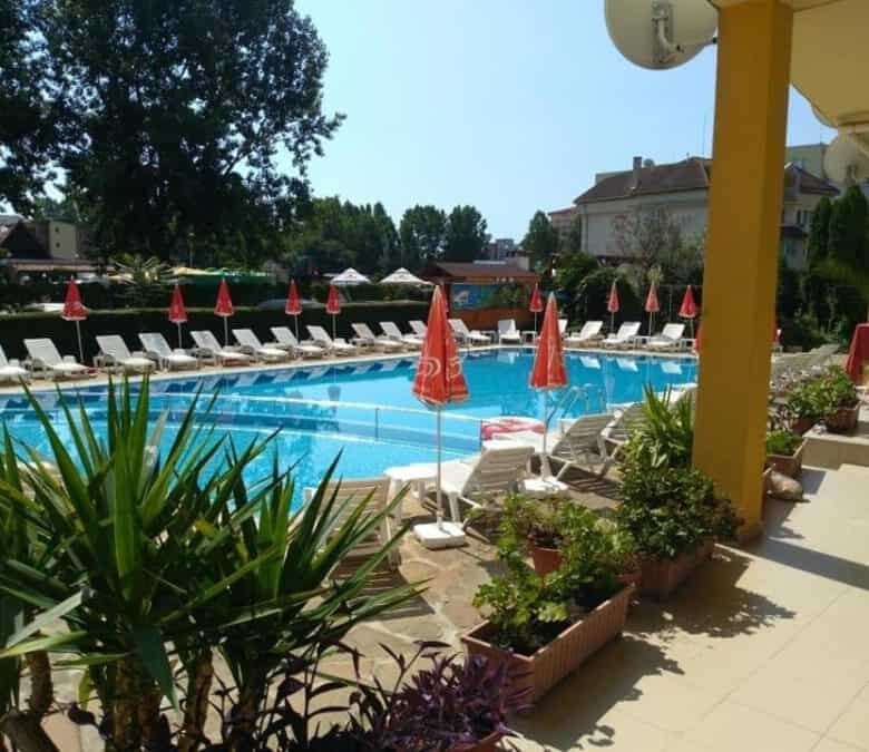 Pool area with sun loungers and umbrellas at Blue Summer complex, Sunny Beach, Bulgaria.