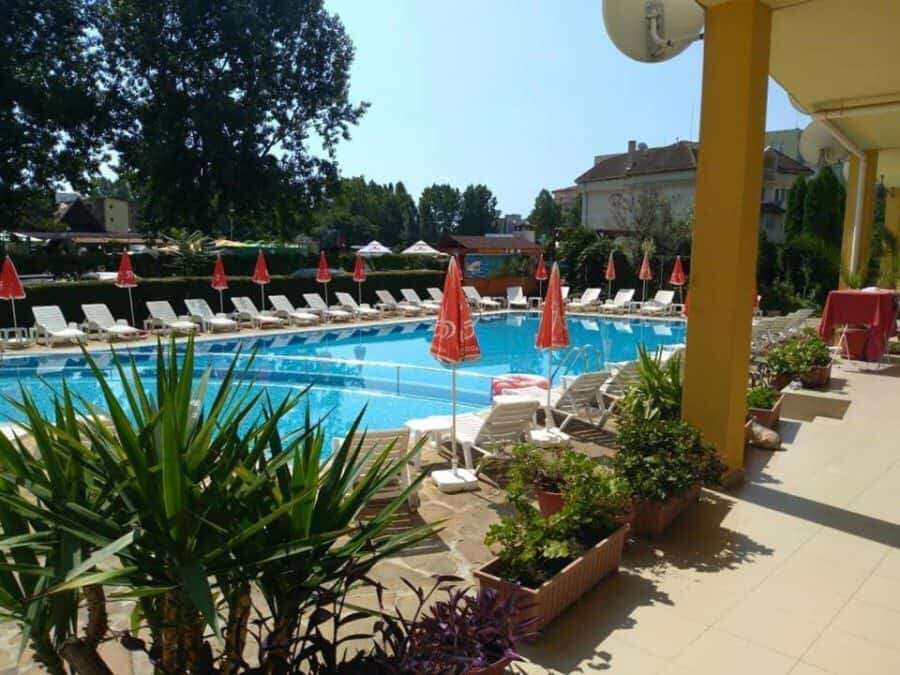 Pool area with sun loungers and umbrellas at Blue Summer complex, Sunny Beach, Bulgaria.