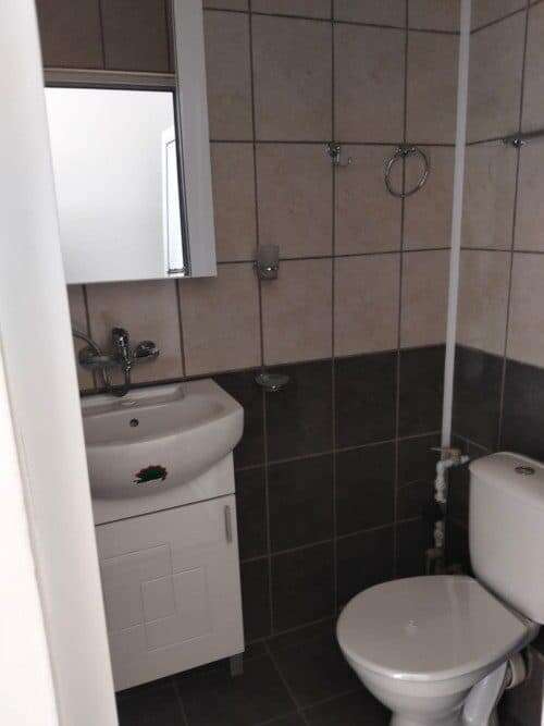 Bathroom with sink and toilet in Blue Summer complex, Sunny Beach, Bulgaria.