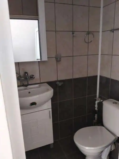 Bathroom with sink and toilet in Blue Summer complex, Sunny Beach, Bulgaria.