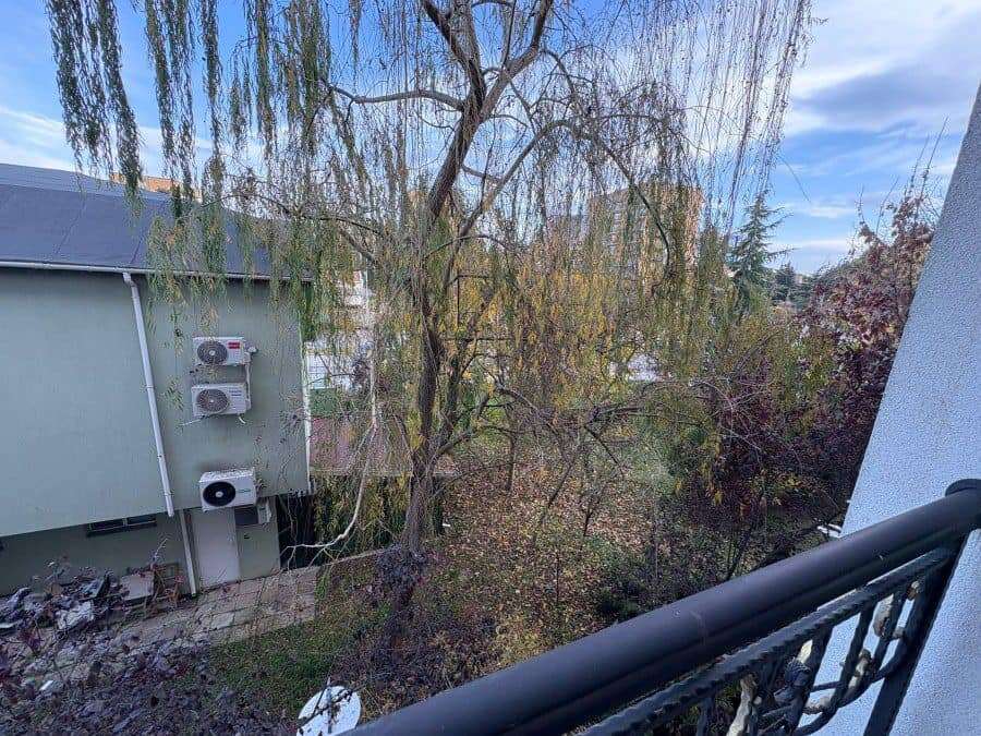 Balcony view of trees and garden area from a 2 bed, 2 bath apartment in Sunny Beach.