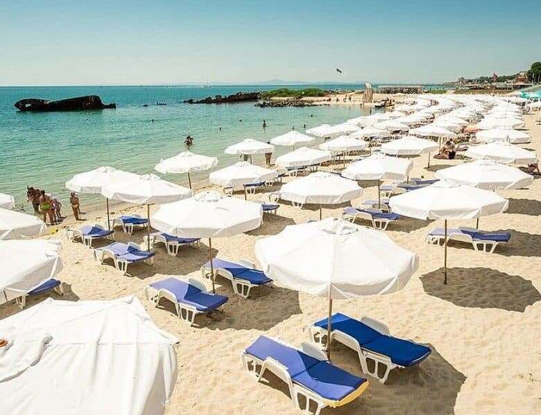 Beach with sunbeds and umbrellas in Nessebar, just 30 meters from the sea.