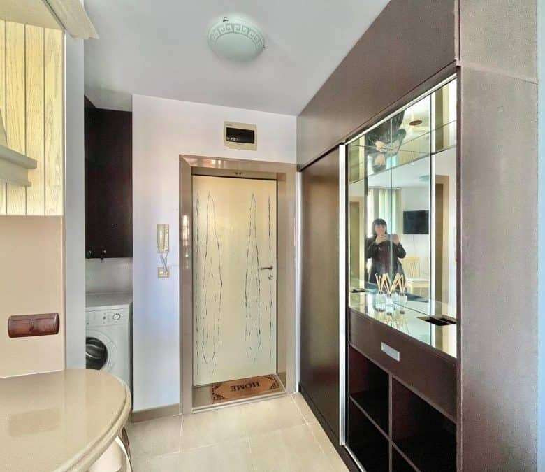 Interior view of a modern 1-bedroom apartment close to Nessebar beach, featuring a compact living sp.