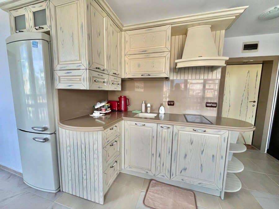 Sea View 1-Bed Apartment in Nessebar Bright kitchen with sea view in Nessebar, 30m from the beach. Modern cabinetry and appliances in a c.