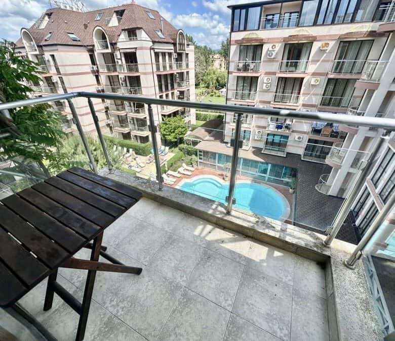 Balcony view of pool and surrounding buildings at Tarsis - Club & Spa in Sunny Beach.