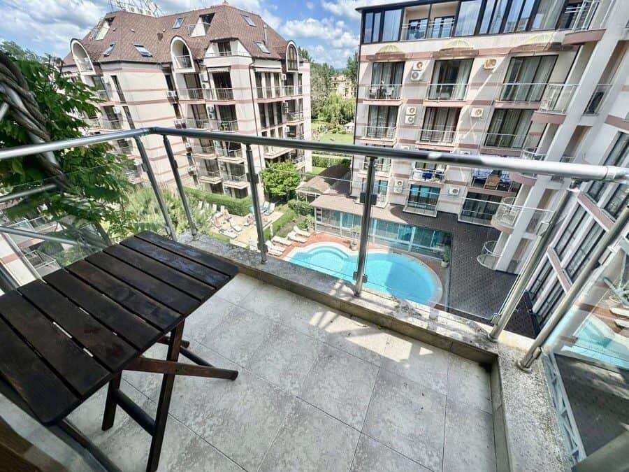 Balcony view of pool and surrounding buildings at Tarsis - Club & Spa in Sunny Beach.