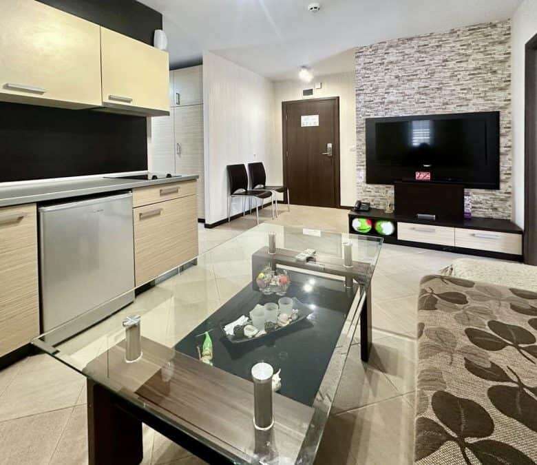 Interior view of a modern 2-bedroom apartment in Tarsis with living room and entertainment area.