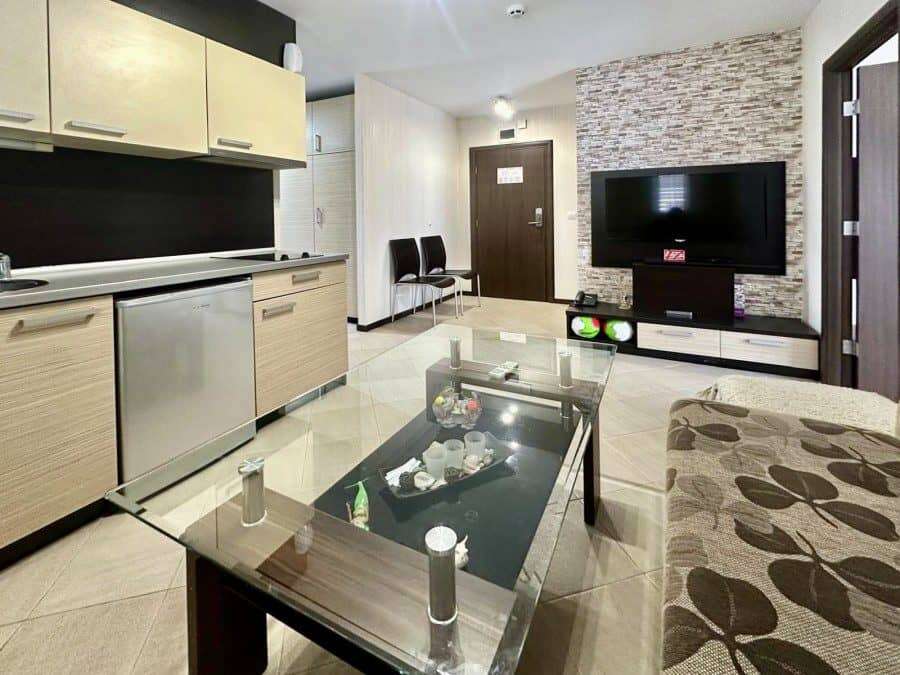 Interior view of a modern 2-bedroom apartment in Tarsis with living room and entertainment area.