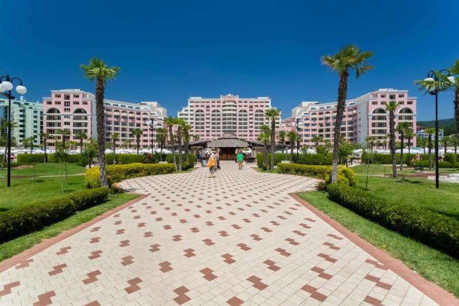 Modern seaside resort in Sunny Beach with lush gardens and palm trees. Beautiful resort with gardens and palm trees in Sunny Beach.