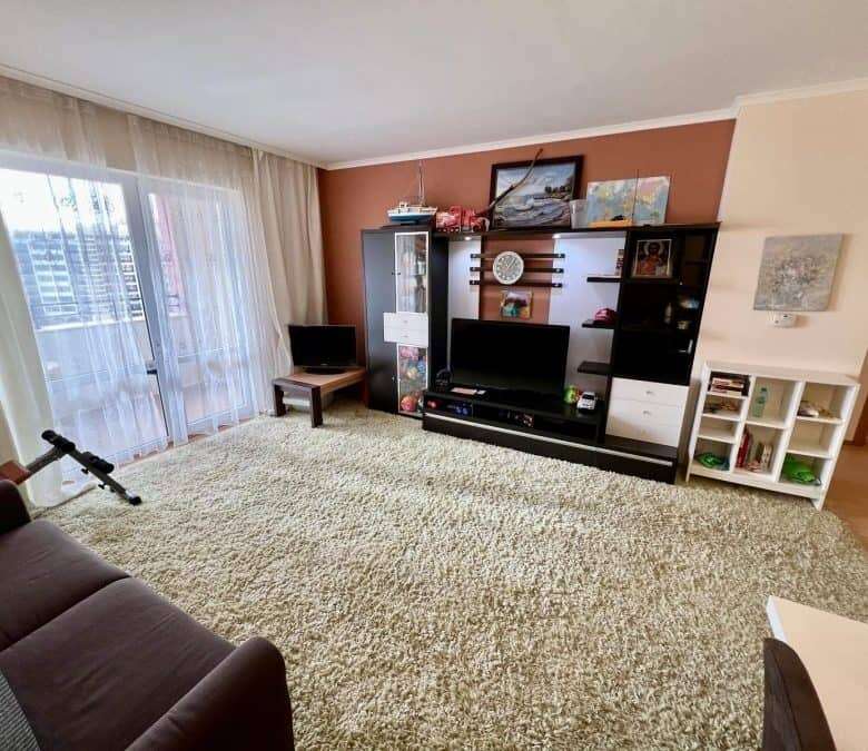 Bright living room featuring large windows with stunning sea views in Majestic Sunny Beach apartment.
