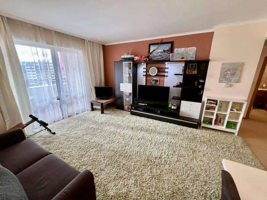 Spacious Living Room with Sea Views in Majestic Sunny Beach Bright living room featuring large windows with stunning sea views in Majestic Sunny Beach apartment.