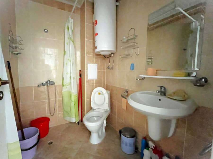 Bright bathroom with modern fixtures and essentials for comfortable living.