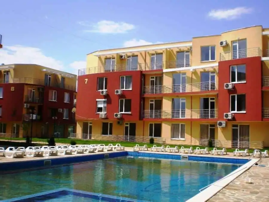 Apartment building with colorful exterior in Sunny Day 5 community.