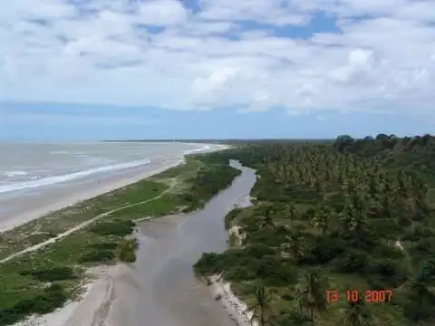 Beautiful coastal land with river and lush greenery in Lucena, ideal for development or investment.