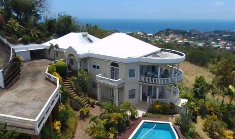 Elegant 5-bedroom villa with ocean views in Harmony Hall, Prospect, St. Vincent. Perfect for luxury.