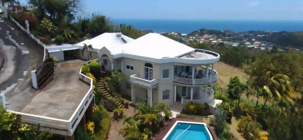 Elegant 5-bedroom villa with ocean views in Harmony Hall, Prospect, St. Vincent. Perfect for luxury.